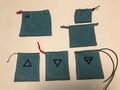 Moon time prototype bags with two symbol placings and various strings
